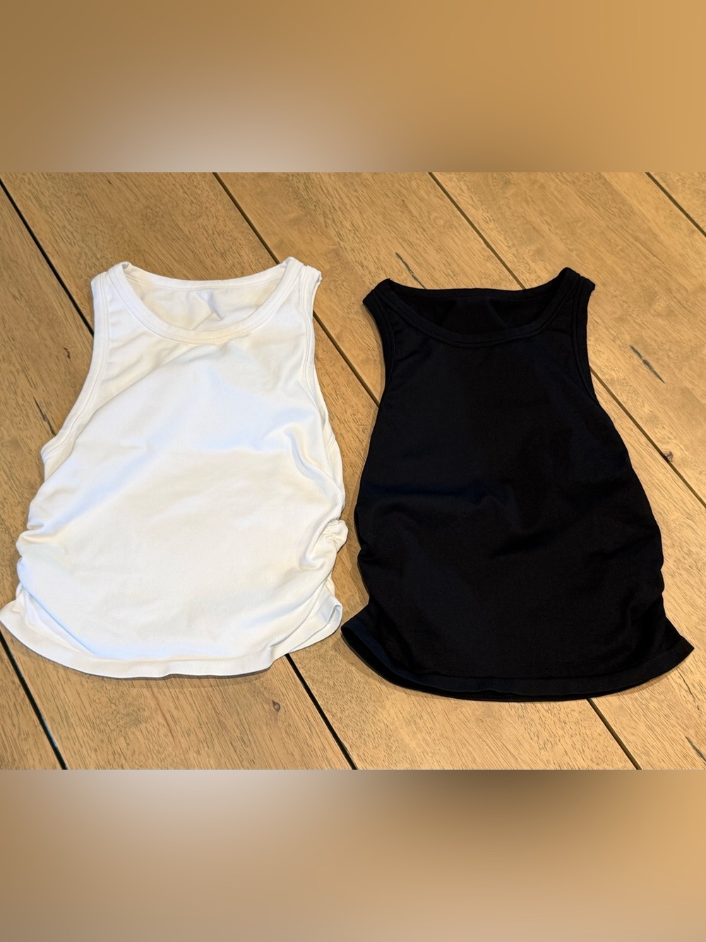 Women’s size small black and white sleeveless shirts